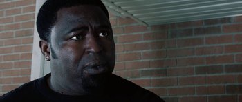 Movie still from “Four Brothers” (2005), directed by John Singleton – A person looking at the camera; Close Up shot, Low angle