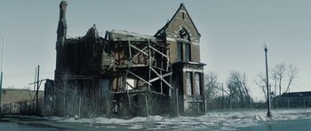 Movie still from “Four Brothers” (2005), directed by John Singleton – An old building with a clock tower in the middle of it; Extreme Wide shot, Low angle