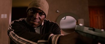 Movie still from “Four Brothers” (2005), directed by John Singleton – A person wearing a hat; Close Up shot, Low angle