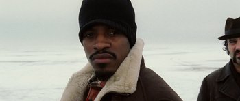 Movie still from “Four Brothers” (2005), directed by John Singleton – A person wearing a jacket and a hat; Close Up shot, Low angle