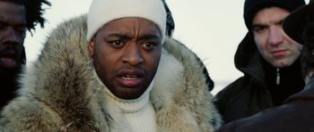 Movie still from “Four Brothers” (2005), directed by John Singleton – A person wearing a hat and a fur coat; Close Up shot, Low angle