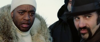 Movie still from “Four Brothers” (2005), directed by John Singleton – Two men in winter coats and hats standing next to each other; Close Up shot, Over the shoulder angle