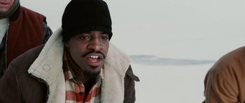 Movie still from “Four Brothers” (2005), directed by John Singleton – A person wearing a jacket and a hat; Close Up shot, High angle