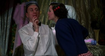 Movie still from “Four Rooms” (1995), directed by Robert Rodriguez – A man and a woman are talking to each other; Medium shot, Low angle