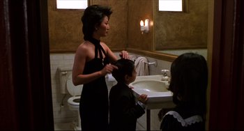 Movie still from “Four Rooms” (1995), directed by Robert Rodriguez – A woman and a child in a bathroom; Medium shot, Over the shoulder angle