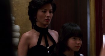 Movie still from “Four Rooms” (1995), directed by Robert Rodriguez – A woman and a girl in black dresses; Close Up shot, Over the shoulder angle