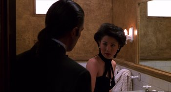 Movie still from “Four Rooms” (1995), directed by Robert Rodriguez – A man and a woman are in a bathroom; Close Up shot, Over the shoulder angle