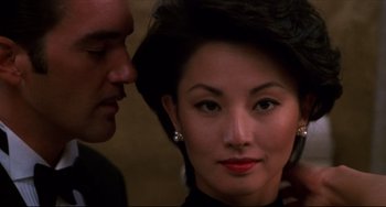 Movie still from “Four Rooms” (1995), directed by Robert Rodriguez – A man and a woman looking into each others eyes; Close Up shot, Over the shoulder angle