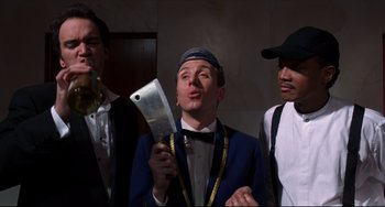 Movie still from “Four Rooms” (1995), directed by Robert Rodriguez – A group of men standing next to each other; Medium shot, Low angle