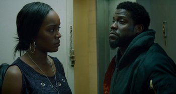 Movie still from “The Upside” (2017), directed by Neil Burger – A man and a woman standing next to each other in a room; Close Up shot, Over the shoulder angle