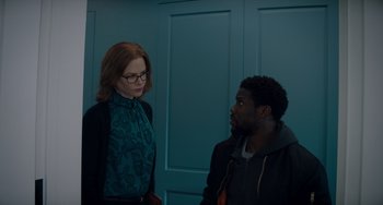 Movie still from “The Upside” (2017), directed by Neil Burger – A woman and a man standing next to each other in a room; Medium shot, Over the shoulder angle