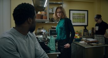 Movie still from “The Upside” (2017), directed by Neil Burger – A woman standing next to a man in a kitchen; Medium shot, Over the shoulder angle