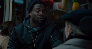Movie still from “The Upside” (2017), directed by Neil Burger – A person talking to another person; Close Up shot, Over the shoulder angle
