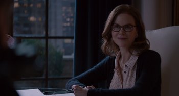 Movie still from “The Upside” (2017), directed by Neil Burger – A woman sitting at a table in front of a window; Close Up shot, Over the shoulder angle