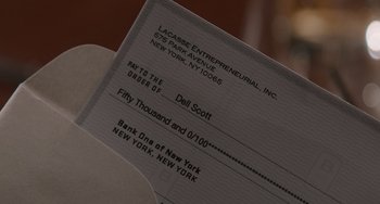Movie still from “The Upside” (2017), directed by Neil Burger – A paper receipt; Extreme Close Up shot, Overhead angle