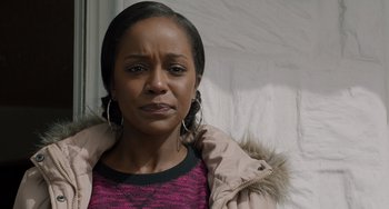 Movie still from “The Upside” (2017), directed by Neil Burger – A person wearing a jacket; Close Up shot, Over the shoulder angle