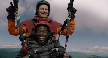 Movie still from “The Upside” (2017), directed by Neil Burger – A man and a man in a red and orange jacket; Medium shot, Low angle
