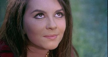 Movie still from “Four Times That Night” (1971), directed by Mario Bava – A woman's face with brown eyes; Close Up shot, High angle
