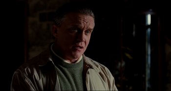 Movie still from “Foxcatcher” (2014), directed by Bennett Miller – A person wearing a jacket; Close Up shot, Over the shoulder angle