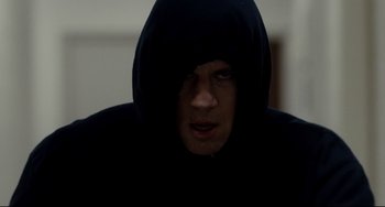 Movie still from “Foxcatcher” (2014), directed by Bennett Miller – A man in a black hooded sweatshirt looking at the camera; Close Up shot, Low angle