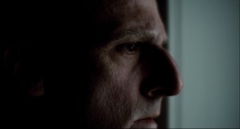Movie still from “Foxcatcher” (2014), directed by Bennett Miller – A man's face in the dark; Extreme Close Up shot, Low angle
