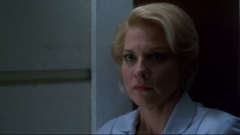 Movie still from “Frailty” (2001), directed by Bill Paxton – A person with blonde hair; Close Up shot, Low angle