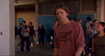 Movie still from “Freaky Friday” (2003), directed by Mark Waters – A young man standing in front of a group of people; Medium shot, Low angle