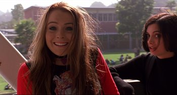 Movie still from “Freaky Friday” (2003), directed by Mark Waters – A woman with long hair smiles for the camera; Medium shot, Over the shoulder angle