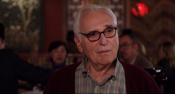 Movie still from “Freaky Friday” (2003), directed by Mark Waters – An older man wearing glasses and wearing a sweater; Close Up shot, Over the shoulder angle