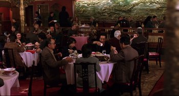 Movie still from “Freaky Friday” (2003), directed by Mark Waters – A group of people sitting around a table eating; Wide shot, High angle
