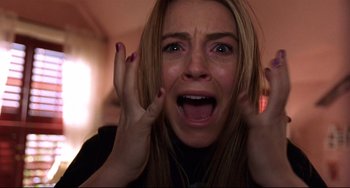 Movie still from “Freaky Friday” (2003), directed by Mark Waters – A person holding their hands up to their face; Close Up shot, Low angle