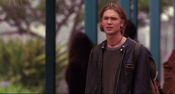 Movie still from “Freaky Friday” (2003), directed by Mark Waters – A young man standing in front of a gorilla; Medium shot, Low angle