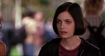 Movie still from “Freaky Friday” (2003), directed by Mark Waters – A person with short black hair; Close Up shot, Over the shoulder angle