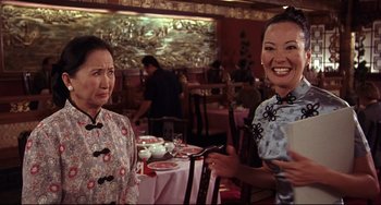 Movie still from “Freaky Friday” (2003), directed by Mark Waters – Two women are sitting at a table in an asian restaurant; Medium shot, Over the shoulder angle