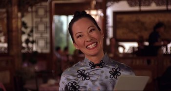 Movie still from “Freaky Friday” (2003), directed by Mark Waters – A woman smiles brightly while wearing a dress; Close Up shot, Low angle