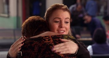 Movie still from “Freaky Friday” (2003), directed by Mark Waters – A woman hugging another woman in a room; Medium shot, Over the shoulder angle