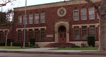 Movie still from “Freaky Friday” (2003), directed by Mark Waters – A building with a clock on the front of it; Extreme Wide shot, Low angle
