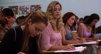 Movie still from “Freaky Friday” (2003), directed by Mark Waters – A group of women sitting at a desk in a classroom; Medium shot, Low angle