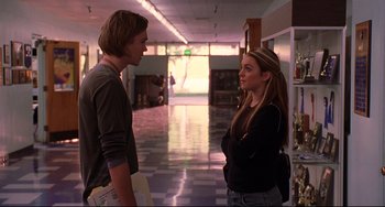 Movie still from “Freaky Friday” (2003), directed by Mark Waters – A man and a woman standing next to each other in a building; Medium shot, Over the shoulder angle