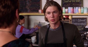 Movie still from “Freaky Friday” (2003), directed by Mark Waters – A man in an apron standing in front of a woman; Close Up shot, Over the shoulder angle