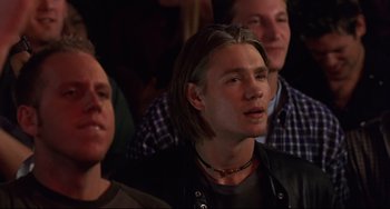 Movie still from “Freaky Friday” (2003), directed by Mark Waters – A group of people sitting in front of each other; Close Up shot, Low angle