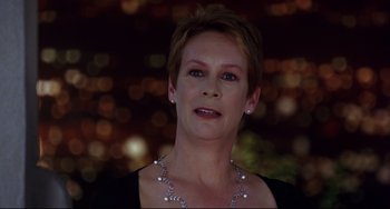 Movie still from “Freaky Friday” (2003), directed by Mark Waters – A person with short hair wearing a necklace; Close Up shot, Low angle