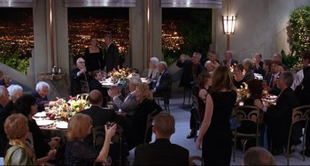 Movie still from “Freaky Friday” (2003), directed by Mark Waters – A group of people sitting at tables in a room; Wide shot, High angle