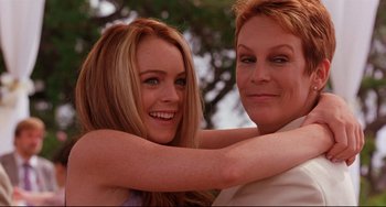 Movie still from “Freaky Friday” (2003), directed by Mark Waters – Two women are hugging and smiling for the camera; Close Up shot, Over the shoulder angle
