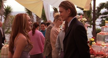 Movie still from “Freaky Friday” (2003), directed by Mark Waters – A group of people standing next to each other at an event; Medium shot, Over the shoulder angle