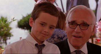 Movie still from “Freaky Friday” (2003), directed by Mark Waters – A boy and an older man wearing ties and glasses; Close Up shot, Over the shoulder angle