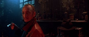 Movie still from “Freddy vs. Jason” (2003), directed by Ronny Yu – A man wearing a red leather jacket in front of a bar; Close Up shot, Low angle