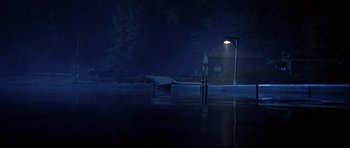 Movie still from “Freddy vs. Jason” (2003), directed by Ronny Yu – A boat is docked at a dock at night; Extreme Wide shot, Low angle