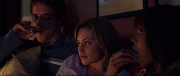 Movie still from “Freddy vs. Jason” (2003), directed by Ronny Yu – A woman sitting next to a man on a couch; Close Up shot, Over the shoulder angle