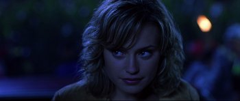 Movie still from “Freddy vs. Jason” (2003), directed by Ronny Yu – A woman's face in the dark; Close Up shot, Over the shoulder angle